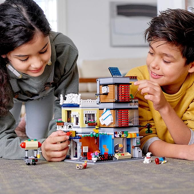 LEGO Creator 3 in 1 Townhouse Pet Shop &amp Café 31097 Toy Store Building Set with Bank Town Playset with a Toy Tram Animal Figures and Minifigures (969 Pieces)