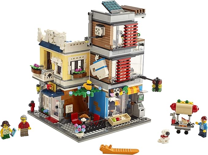 LEGO Creator 3 in 1 Townhouse Pet Shop &amp Café 31097 Toy Store Building Set with Bank Town Playset with a Toy Tram Animal Figures and Minifigures (969 Pieces)