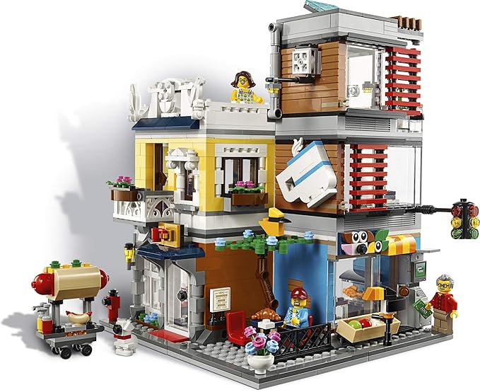 LEGO Creator 3 in 1 Townhouse Pet Shop &amp Café 31097 Toy Store Building Set with Bank Town Playset with a Toy Tram Animal Figures and Minifigures (969 Pieces)