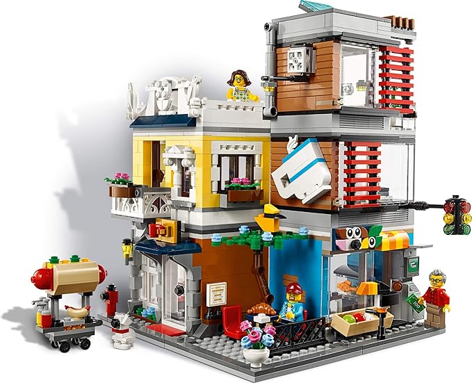 LEGO Creator 3 in 1 Townhouse Pet Shop &amp Café 31097 Toy Store Building Set with Bank Town Playset with a Toy Tram Animal Figures and Minifigures (969 Pieces)